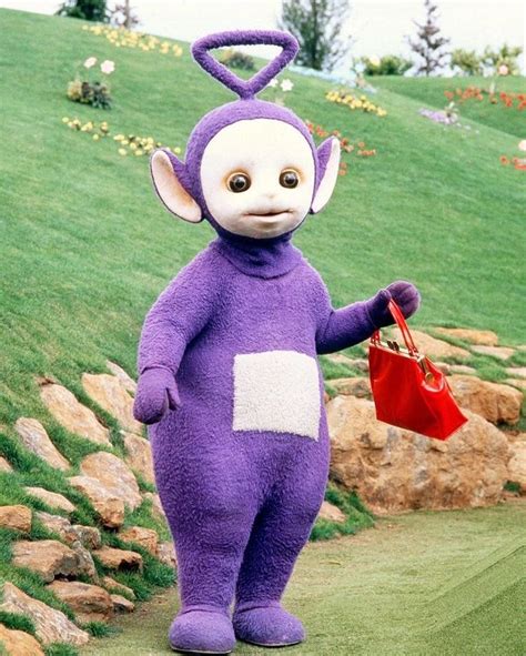 “Tinky Winky, the tallest Teletubby (10 feet/304cm), holding his red ...