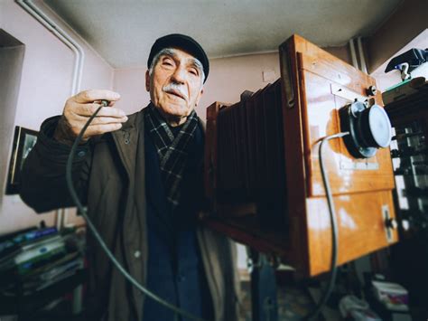 Man Using a Vintage Camera · Free Stock Photo