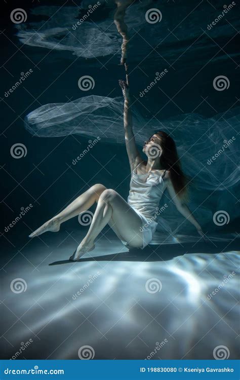 Beautiful Girl in White Dress Underwater. Water Magic. Underwater Photography. Art Stock Photo ...