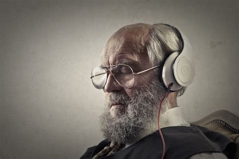 Premium Photo | Old man listening to music