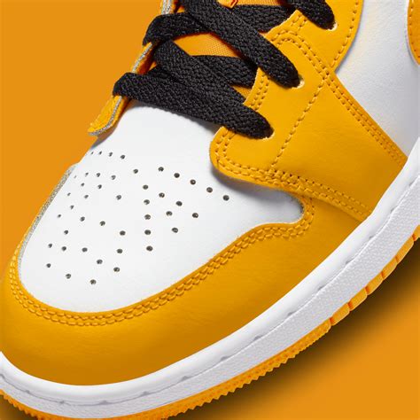 Air Jordan 1 Low "University Gold/Black" 553558-701 | SneakerNews.com