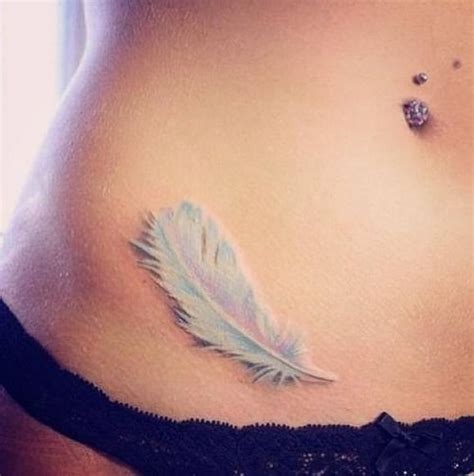 Tender white feather tattoo on belly - Tattooimages.biz