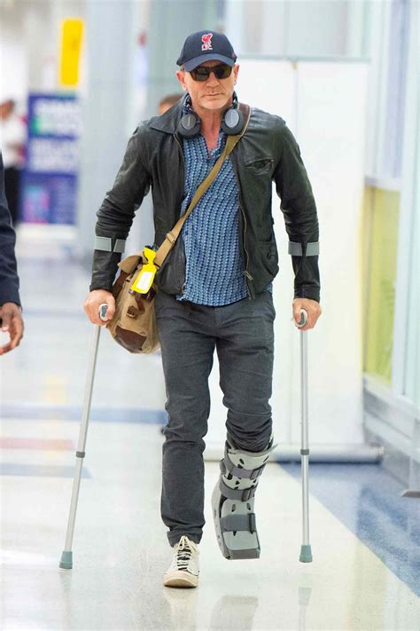 Daniel Craig Walks on Crutches After Ankle Injury on James Bond Set