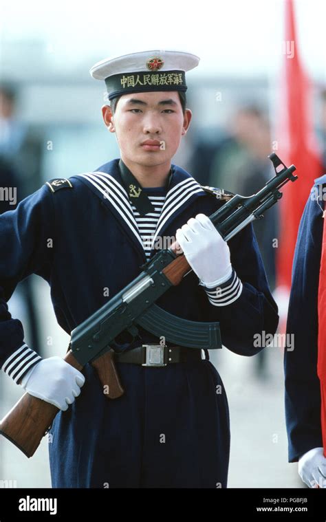 A Chinese sailor, armed with a Type 56 assault rifle, stands watch during a welcoming ceremony ...
