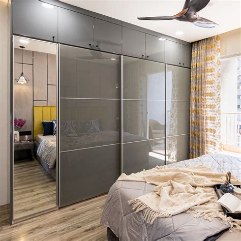 Grey And Silver Frost Sliding Door Wardrobe Design With Integrated Mirror | Livspace