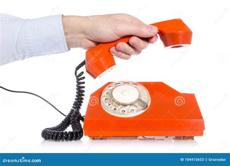 Hand picking up a phone stock image. Image of phone - 104415653