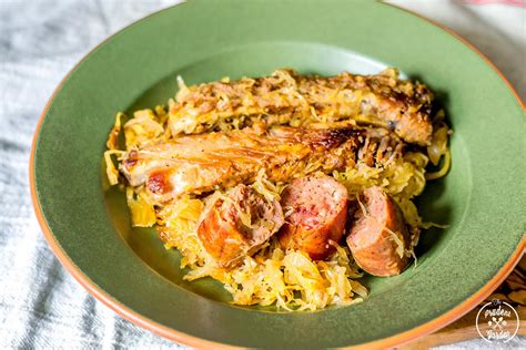 a green plate topped with meat and rice