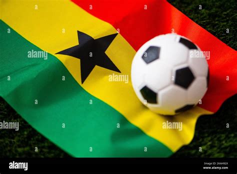 Ghana national football team. National Flag on green grass and soccer ...