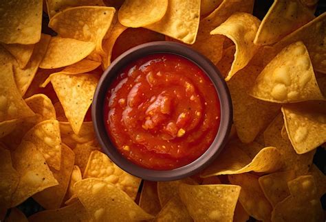 Premium Photo | Mexican nacho spicy nachos with tomato sauce nachos ...