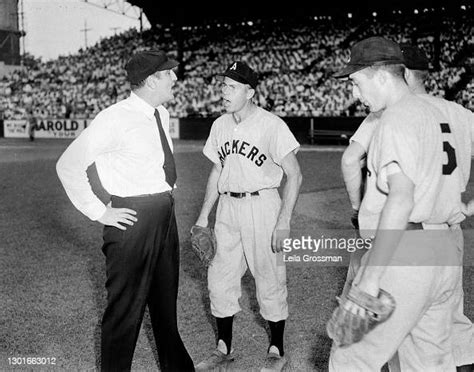 A view of a few Atlanta Crackers baseball players arguing with a... News Photo - Getty Images