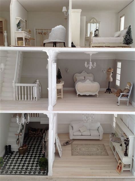 a doll house with all white furniture and accessories in it's display ...