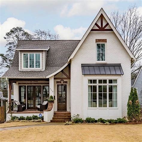 This cottage home exudes perfect curb appeal!🖤 . . Builder ...