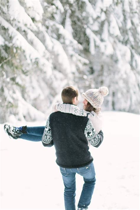 Winter Fun Couple Playful Together during Winter Holidays Vacation Outside in Snow Forest. Stock ...