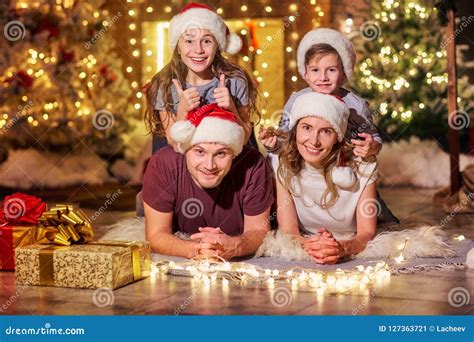 Happy Family in a Room with a Christmas Tree. Stock Image - Image of ...