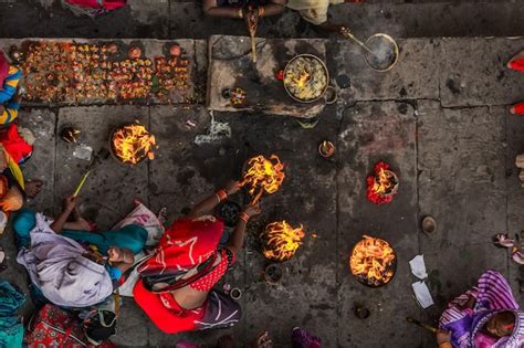 Premium Photo | Ariel shot of women performing rituals on a bank of ...