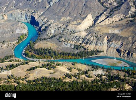 Aerial of Chilcotin River and grasslands in autumn of British Columbia ...