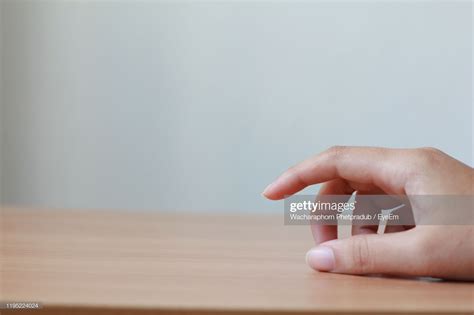 Close-Up Of Hand On Table | Close up, Place card holders, Stock photos