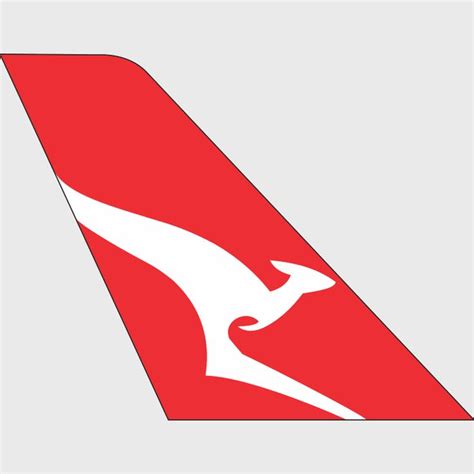 the tail end of an airplane that is red and white with a kangaroo on it