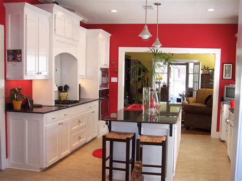 Love this classic red kitchen that features bright white cabinets and a ...