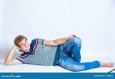 Full-length Portrait of a Handsome Man Lying Stock Photo - Image of ...