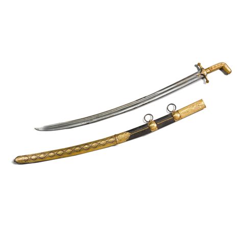 A gold-hilted sword (saif) and scabbard, Arabian Peninsula, circa 1900 ...