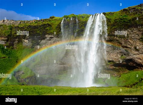 Seljalandsfoss Waterfall with rainbow, Seljalandsá river, Suðurland ...