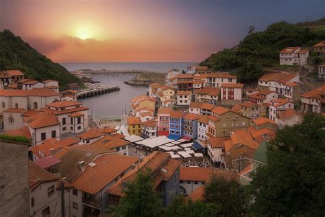 Houses in Cudillero port on cliff in Asturias Photograph by Mikel ...