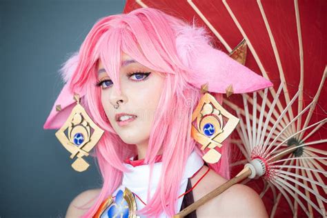 Female Cosplayer in a Pink Anime Costume Wearing Pink Hair Stock Image - Image of victorious ...