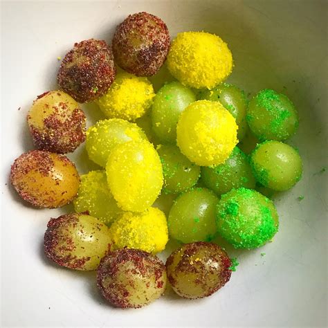 Make “sour patch” candy grape snacks by tossing grapes in lemon juice and different flavors of ...