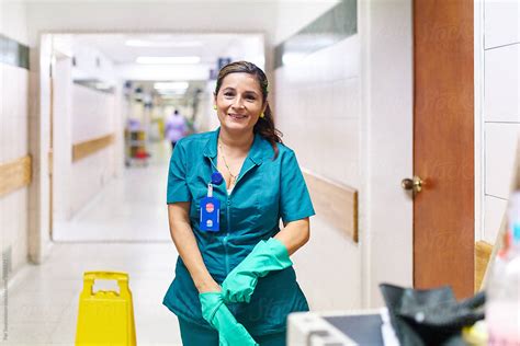 "Happy Cleaning Worker:Happy Hospital Cleaning Woman" by Stocksy Contributor "PER Images" - Stocksy