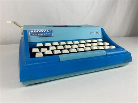 The blue typewriter with white keyboard - Just Melanie W.