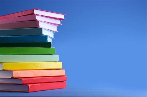 Premium Photo | Colorful books on blue background