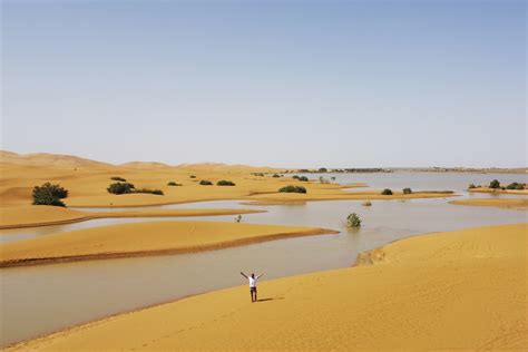 Water gushes through the arid Sahara Desert after unexpected rainfall - CGTN