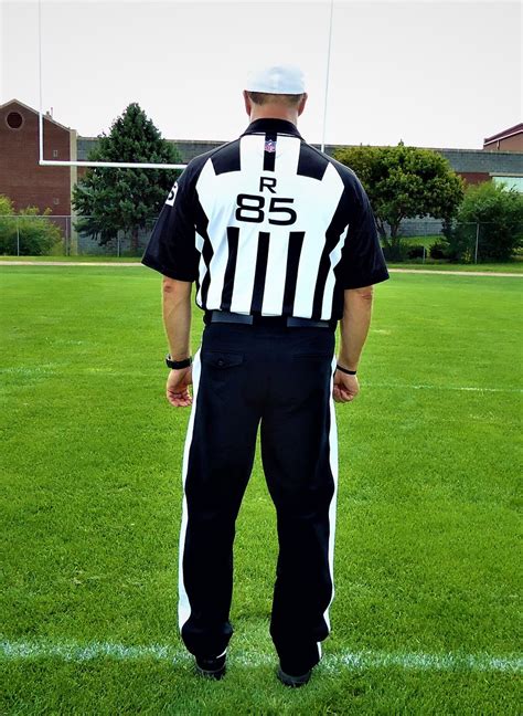 NFL Referee uniform with black striped pants and Reebok sh… | Flickr