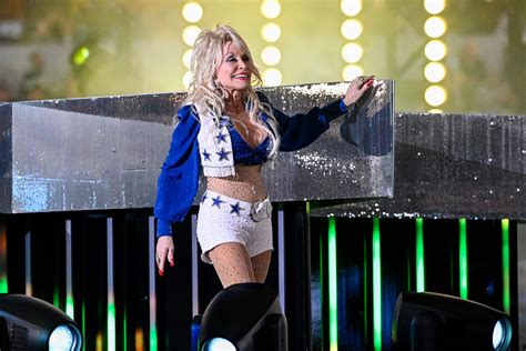 See photos of Dolly Parton performing at Dallas Cowboys football game