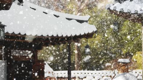 Winter scenery of Hanok Village with snow falling Stock Video | Adobe Stock