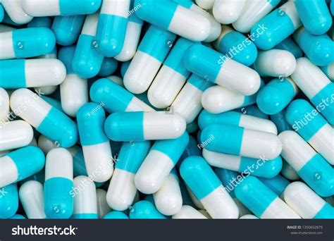 Top view pile of blue and white antibiotic capsule pills texture ...