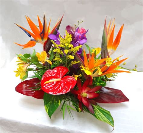 tropical centerpiece | Tropical flower arrangements, Tropical floral ...