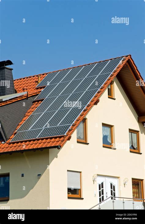 Roof with solar panels in Germany Stock Photo - Alamy