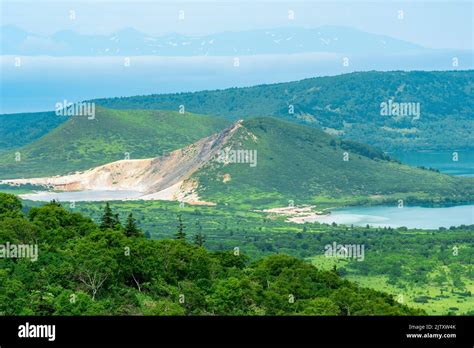 landscape of Kunashir Island, geothermal lakes among lava domes in the ...