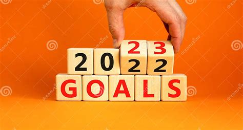 Planning 2023 Goals New Year Symbol. Businessman Turns a Wooden Cube and Changes Words Goals ...