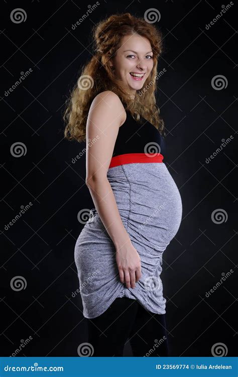 Pregnant woman laughing stock photo. Image of abdomen - 23569774