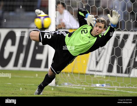 German international goalkeeper Manuel Neuer saves a ball during the international friendly ...