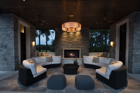 A symmetric look and warm lighting constructs an inviting outdoor seating area. A Kurtz Home ...