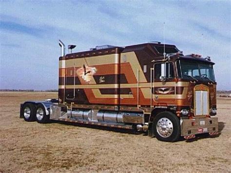 This Custom Gold and Brown Cabover With A Pretty Long Sleeper