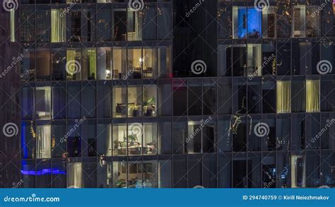 Frontal View of Night Facade of Building with a Lot of Windows with ...