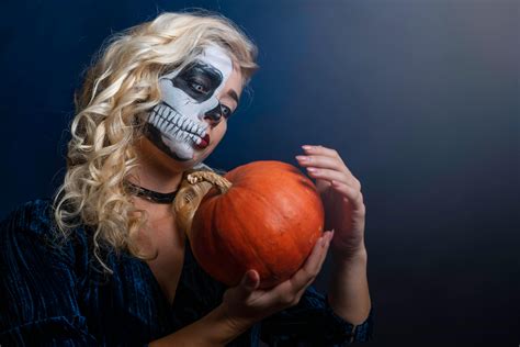 Woman With Face Paint With Pumpkin · Free Stock Photo