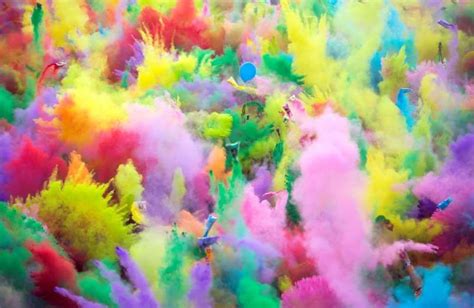 Festival goers enjoy the color party, when participants throw colored ...