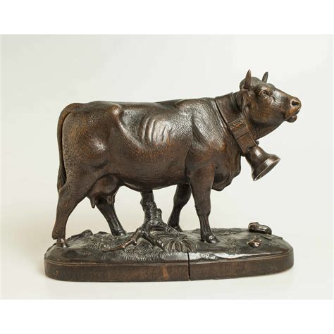 Pair of Carved Wood Cow Sculptures | Witherell's Auction House