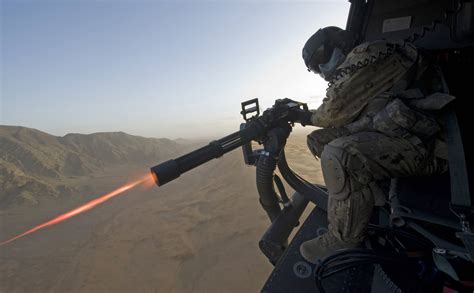 Canadian Soldier Firing Minigun from a Chinook in Afghanistan ...